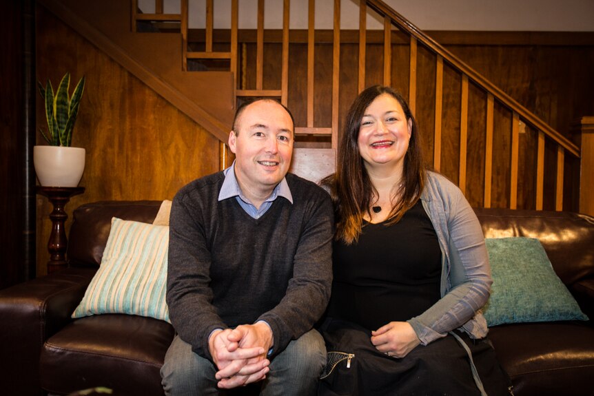 Previous Theatre Royal owners David Stretch and Sarah Burdekin sitting on their couch.