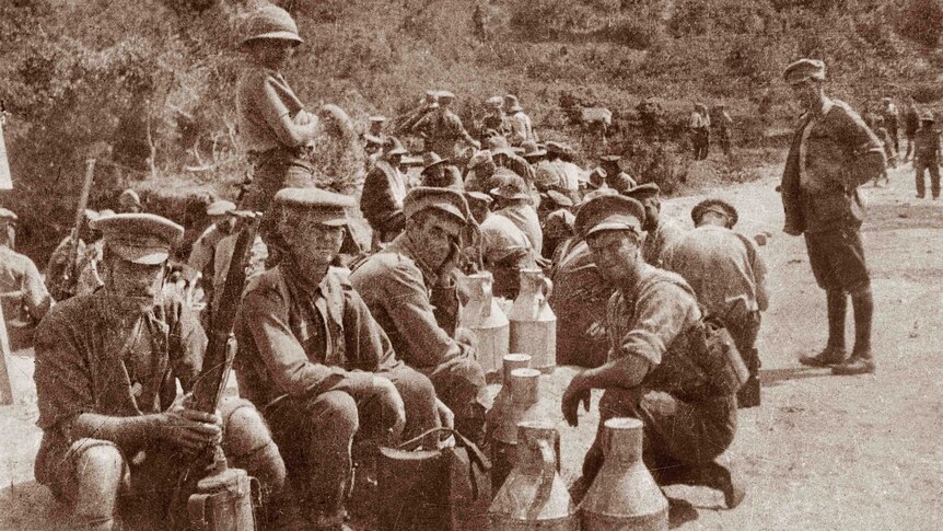 Gallipoli Peninsula, Turkey, May 1915. Members of a fatigue party resting on Anzac Beach. The party was sent down to retrieve rations and water.