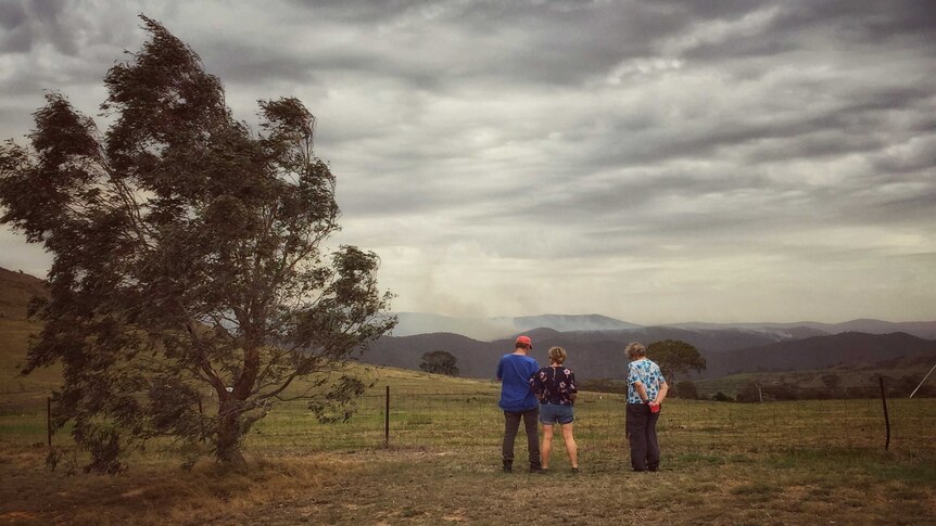 Kambah residents overlook the dark sky as winds pick up in the early afternoon.