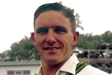 An Australian male cricketer pictured with his arms folded during his Test career.