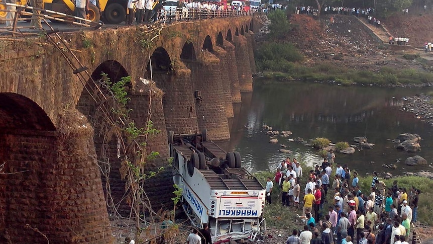 Bus plunges from bridge in western India