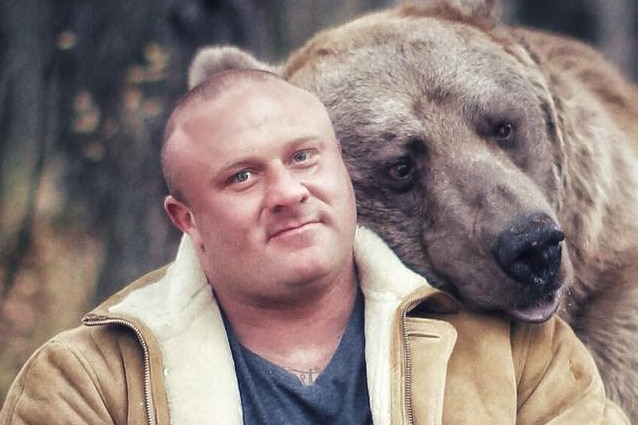 Tasmanian bodybuilder Wayne Howlett with bear.