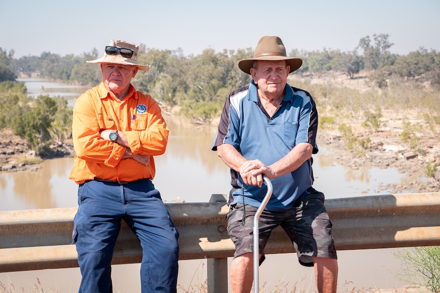 Gomeroi elders Ron Waters and Sam Saunders sit on top of the E.J Beardmore Dam near St George, Queensland, August 2023.