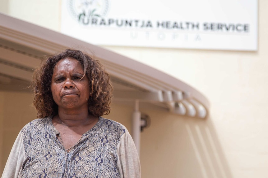 Urapuntja Health Service board Chairman Joyce Jones standing outside the health service building.