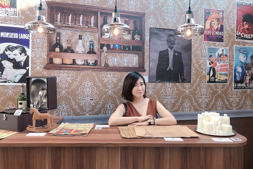 A woman sitting in a cafe. 