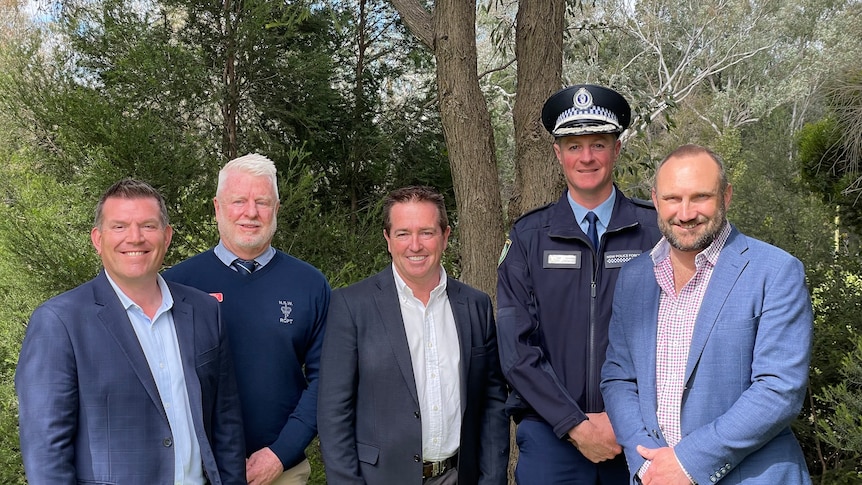 Speakers from Biosecurity conference standing together facing camera 