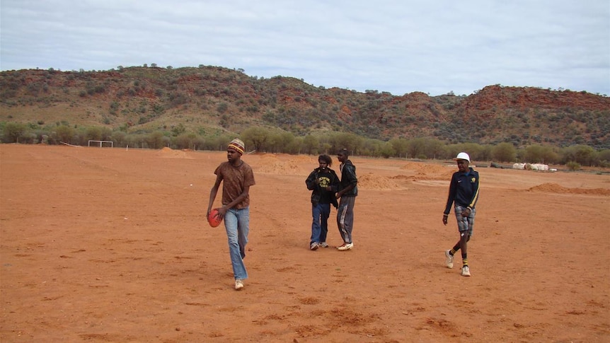 Indigenous children play on the Areyonga football oval