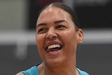 A Southside Flyers player stands on the court during a 2020 WNBL game.