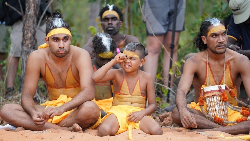 Dancers sit at the opening ceremony for Garma 2019.