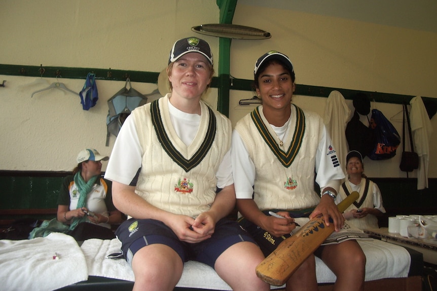 Kate Blackwell and Lisa Sthalekar are sitting next to each other, smiling at the camera.