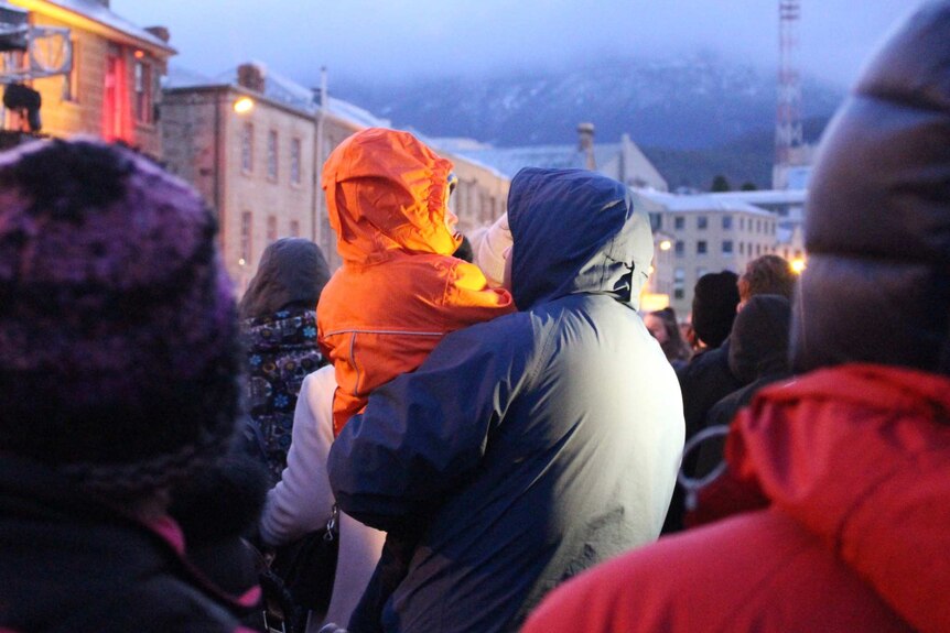 A crowd rugged up in winter coats and jackets at the Festival of Voices.