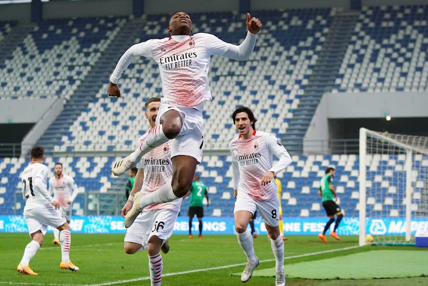 AC Milan's Rafael Leao celebrates after scoring