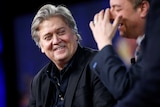 White House Chief Strategist Stephen Bannon listens as White House Chief of Staff Reince Priebus speaks.