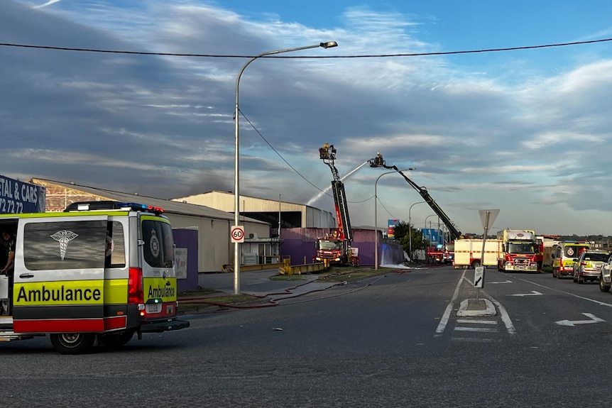 Firefighters douse an industrial blaze 