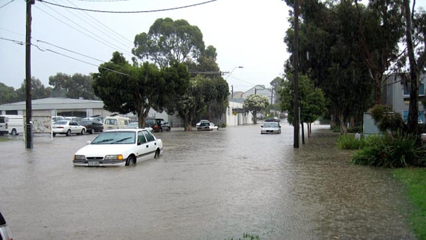Cars make their way through floodwaters in Melbourne, December 1