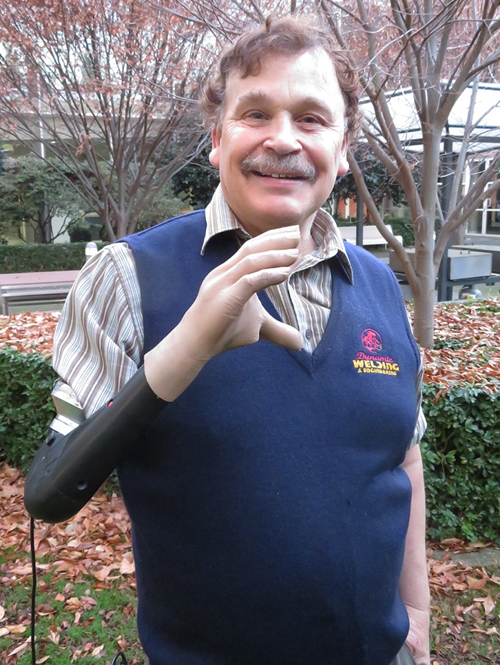 Mark Lesek with his 'mind-controlled' prosthetic arm at ABC Hobart, June 2017.