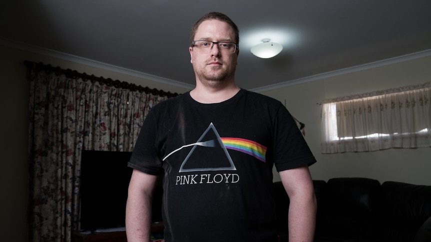 A man wearing a Pink Floyd shirt.