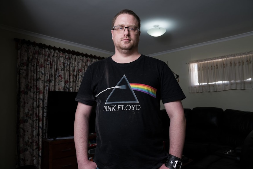 A man wearing a Pink Floyd shirt.