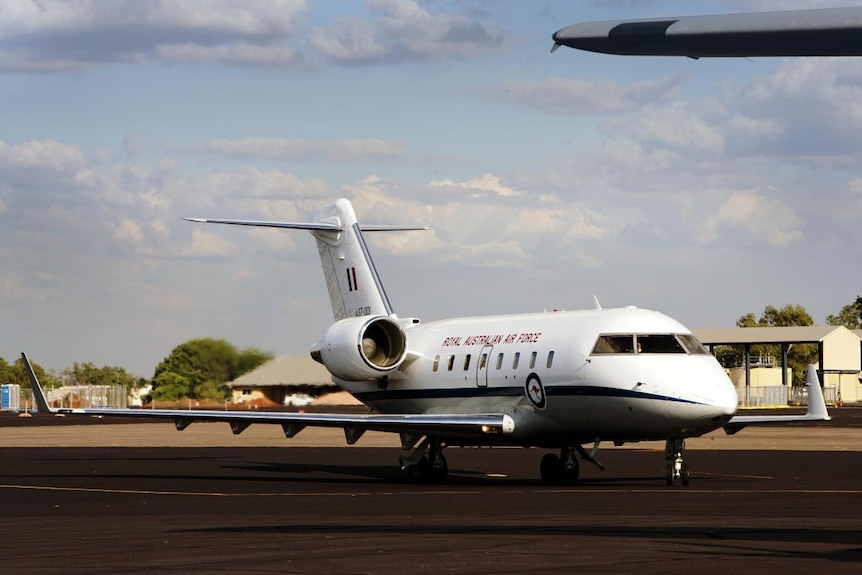 A Royal Australian Air Force plane sits on a runway.