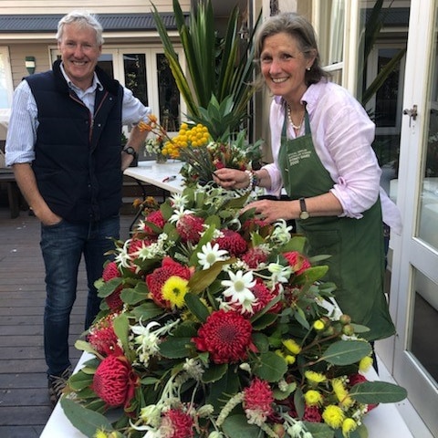 Fiona Nixon and Jamie Creer re-create the Sydney Olympic bouquet for former NSW premier John Fahey's state funeral