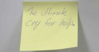 Yellow posit with the words "the ultimate cry for help" written on it.