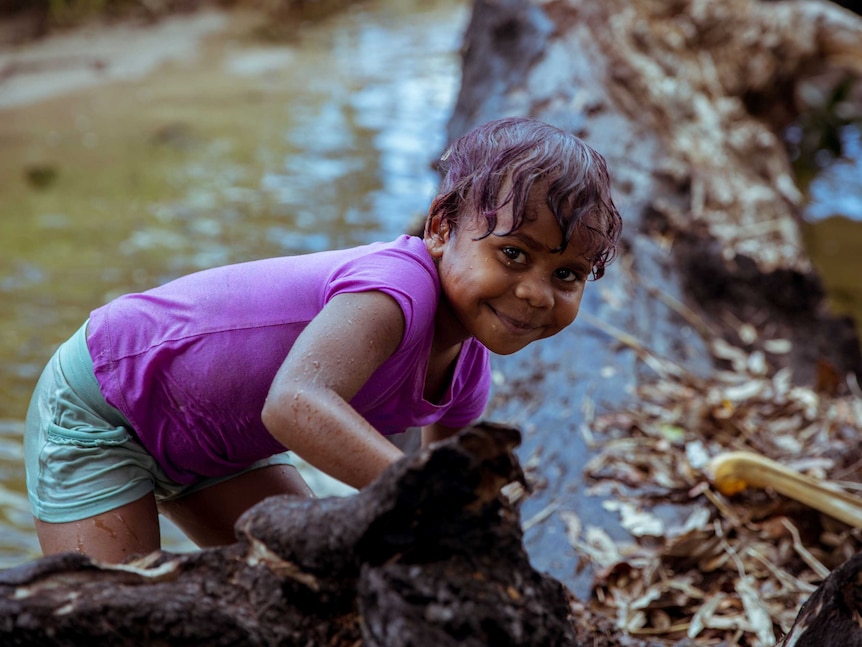 Madison plays in water