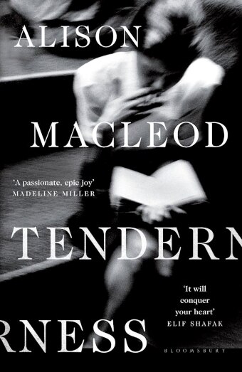 The book cover of Tenderness by Alison MacLeod with a blurry black and white image of a woman smoking and reading a book