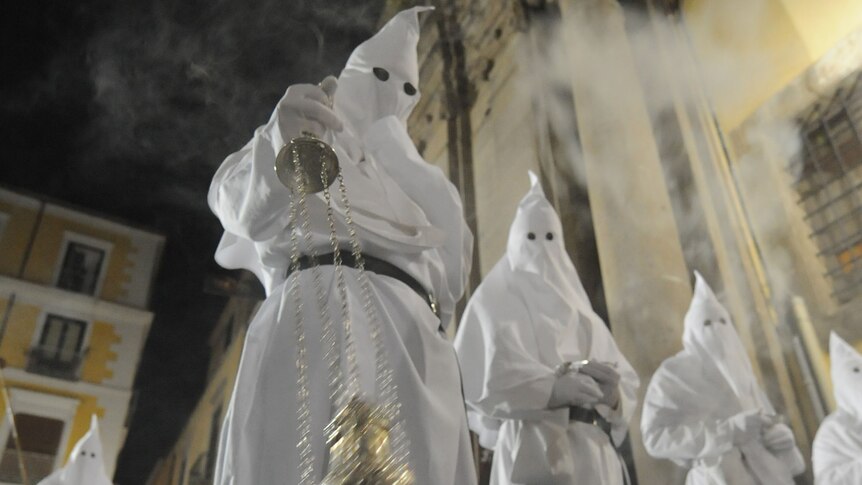 Penitents walk and sing during a Good Friday procession in Sorrento, Italy.