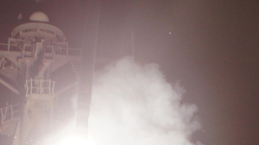 A US guided-missile destroyer launches a Tomahawk missile