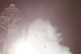 A US guided-missile destroyer launches a Tomahawk missile