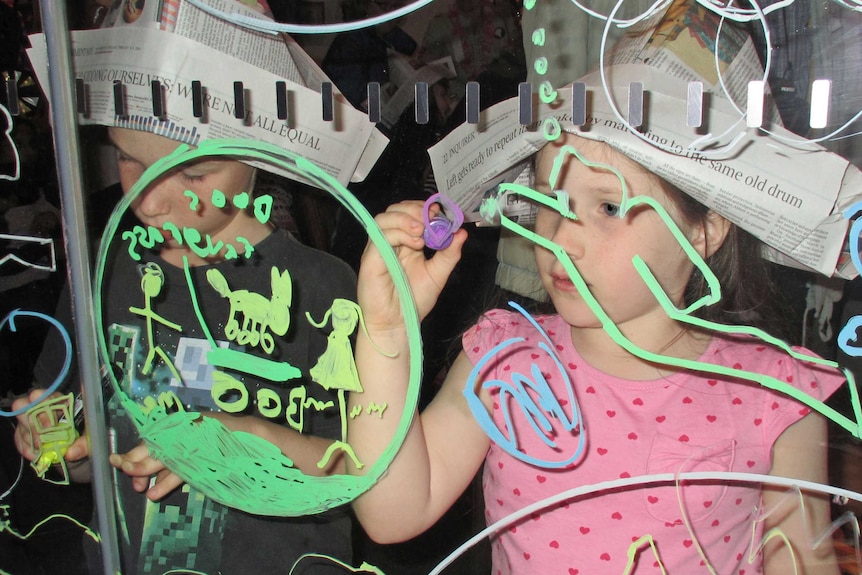 School children were encouraged to make explorers hats and draw landmarks on a large glass map as part of the educational activities.