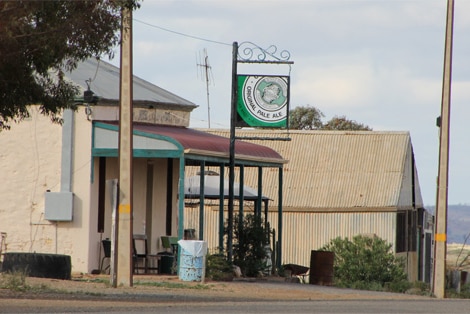 An old-looking country pub on a quiet street.