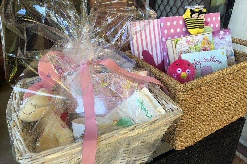 A wrapped hamper of books and toys.