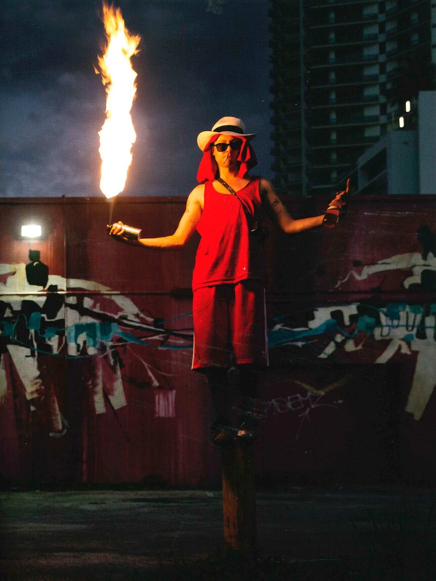 Street artist photographed with fire