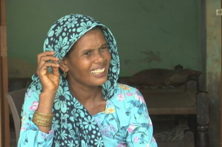 Babita Malika wears a blue scarf and talks about how she moved thousands of kilometres away form Tripura.