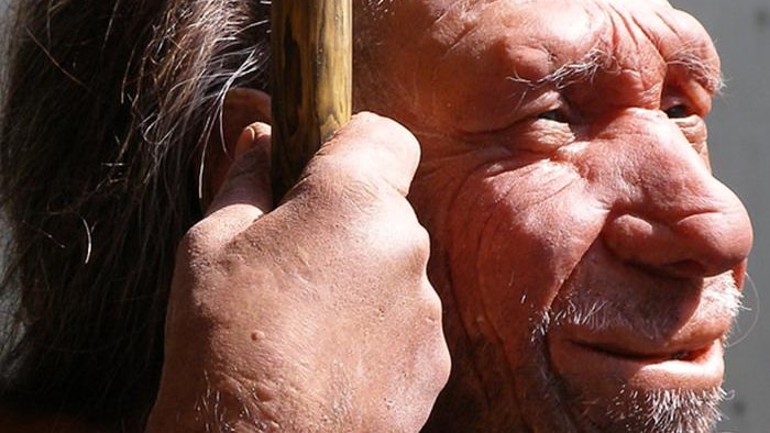 Neanderthal man holds spear