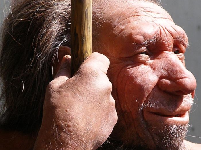 Neanderthal man holds spear