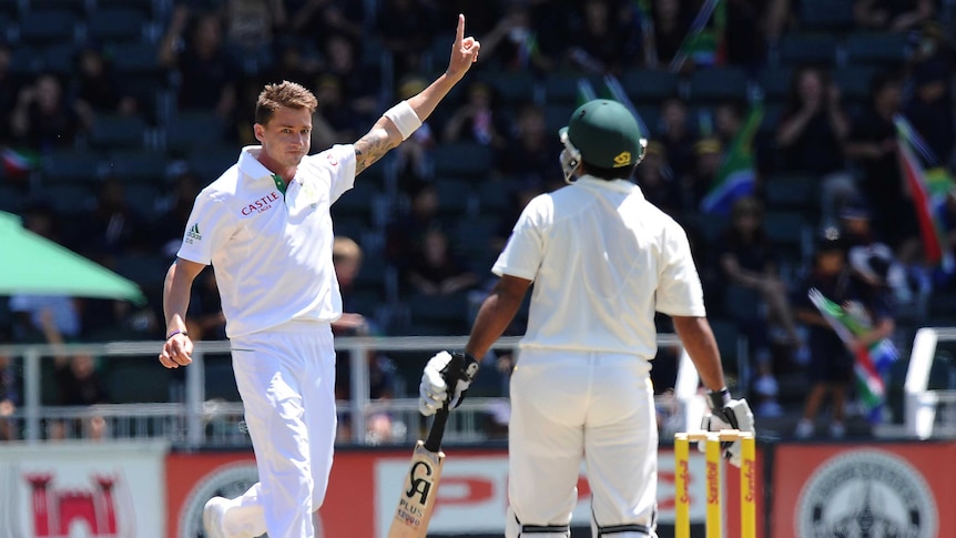 South African fast bowler Dale Steyn (L) celebrates the wicket of Pakistan's Asad Shafiq (R).