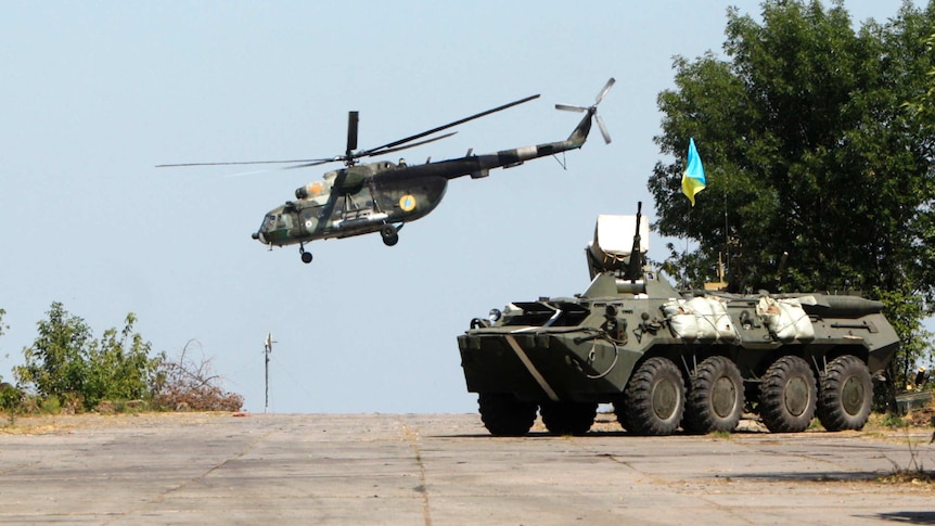 Ukrainian helicopter and troop carrier near Donetsk