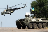 Ukrainian helicopter and troop carrier near Donetsk