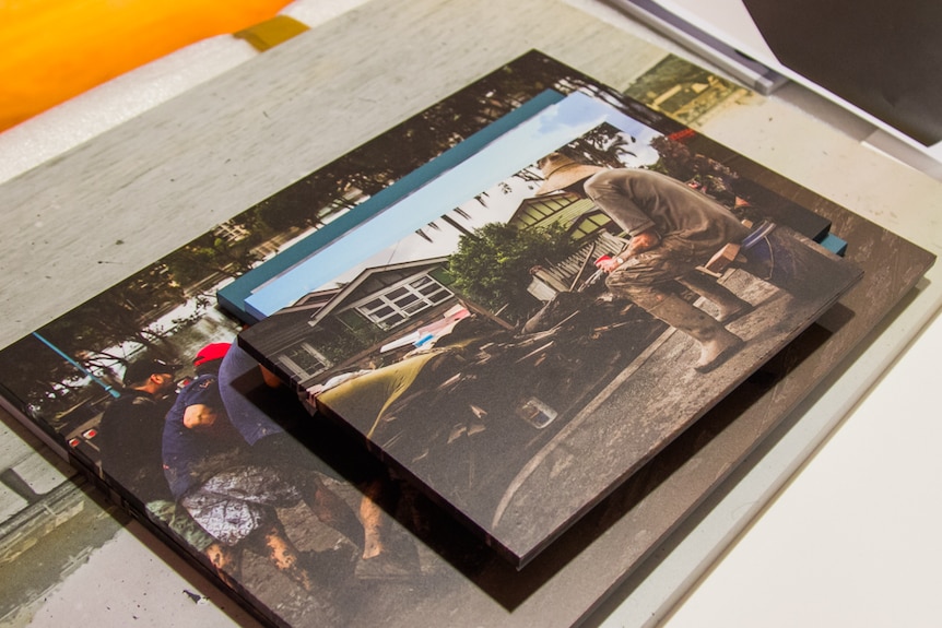 Photos of the Brisbane flood and the mud army appears as part of the exhibition.