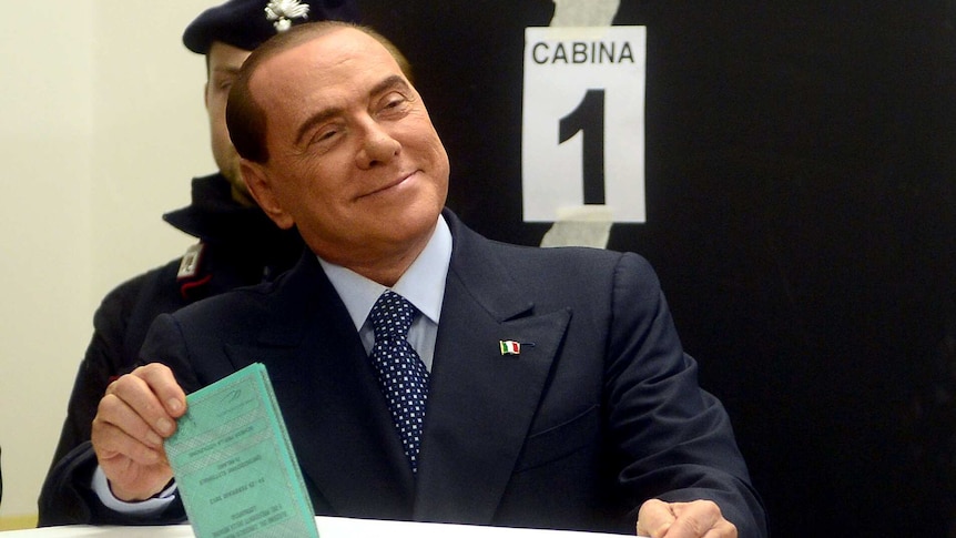 Silvio Berlusconi casts his ballot in Milan