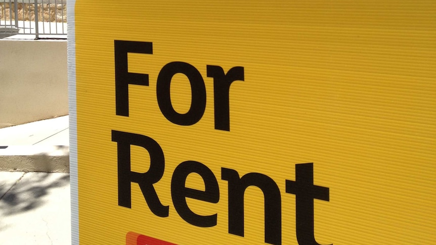 For rent sign outside a new block of units