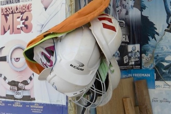 mining helmets hanging outside the video shop