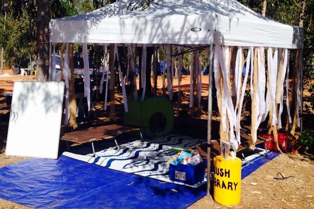 tent with floor mat and decorations housing books