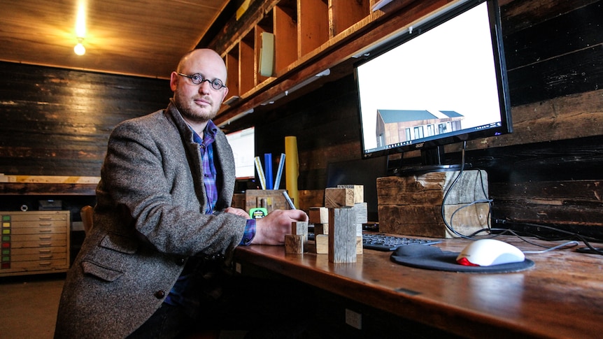 Castlemaine architect Simon Disler in his office sitting in front of a computer.