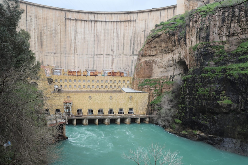 A large dam wall and waterway.