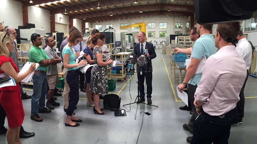 Mr Newman visiting an aircraft parts manufacturer today at Tingalpa in eastern Brisbane.