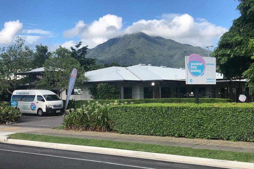 A daycare centre with a minibus in the car park.