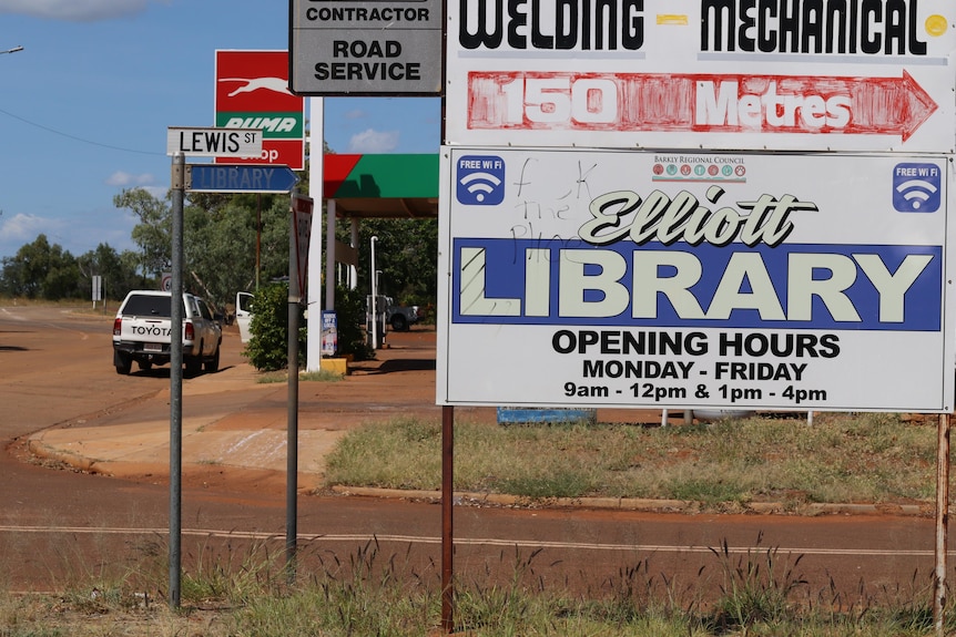 A big town sign in the NT saying Elliott with a petrol station in the background